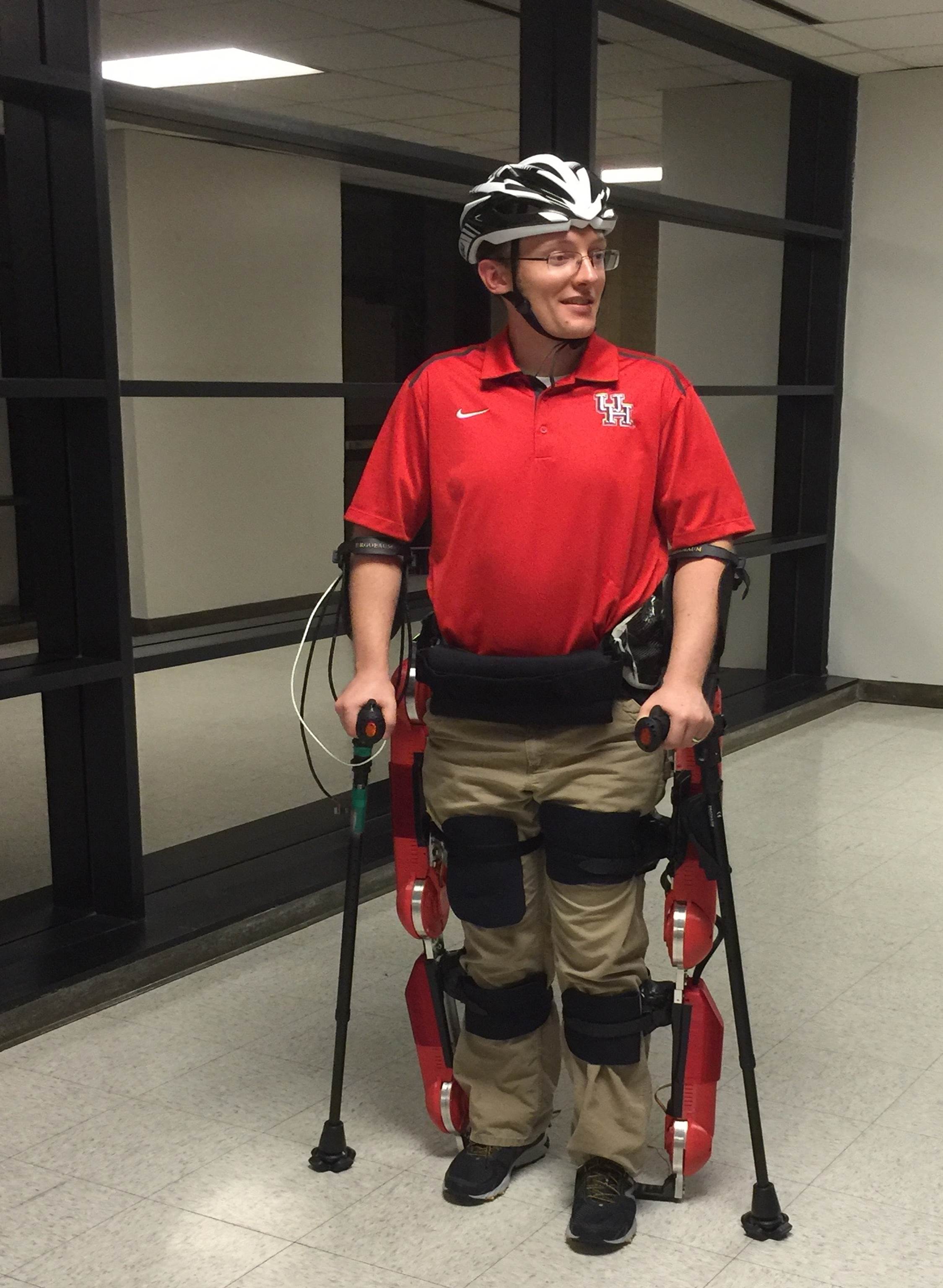 Engineer Jeffrey Gorges piloting the initial version of the functional exoskeleton.